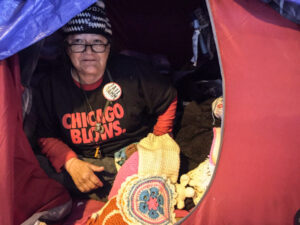 Linda, who crochets hats and other items from her tent beneath the Wilson Avenue viaduct on Lake Shore Drive, is skeptical about the cityÕs promise to find her housing. ÒI aint gonna hold my breath,Ó she said. | Mark Brown/Sun-Times