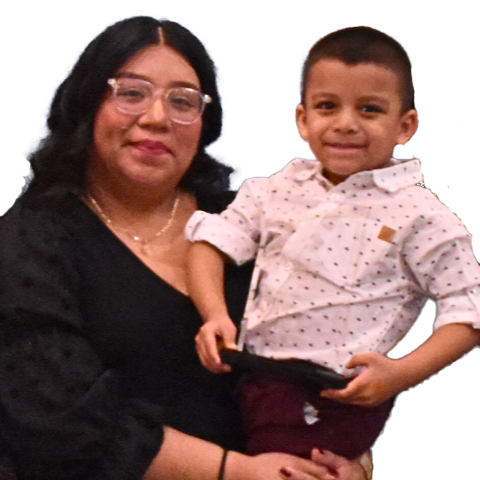 Julie Campos, a Latina woman in her 20s, holds her young son.