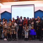 CCH grassroots leaders and their families pose with Mayor Brandon Johnson.