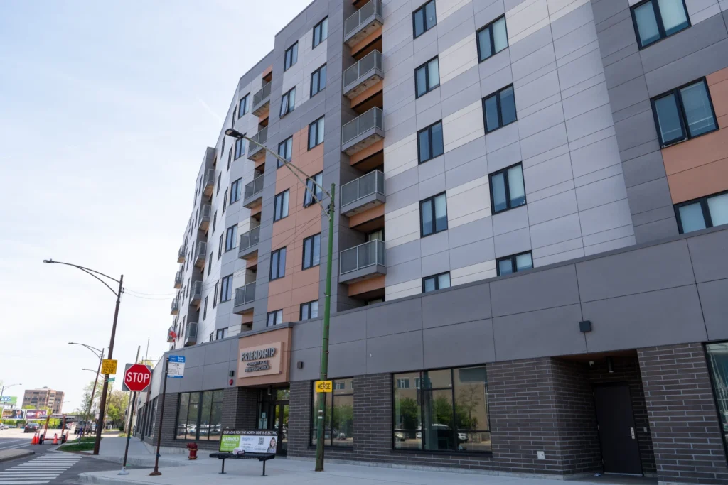 A modern apartment complex with gray walls.