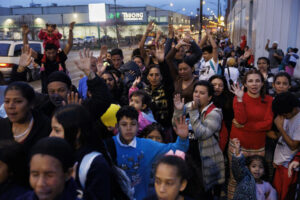 Migrants attend a religious service before eating outside a shelter in Chicago's Lower West Side on March 4, 2024.