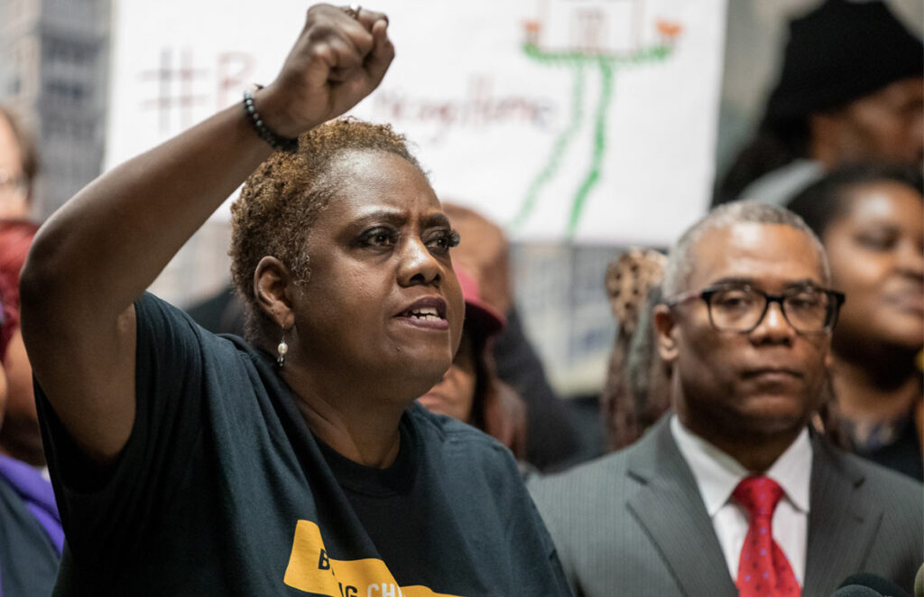 woman passionately raising her fist