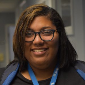 woman with glasses smiling